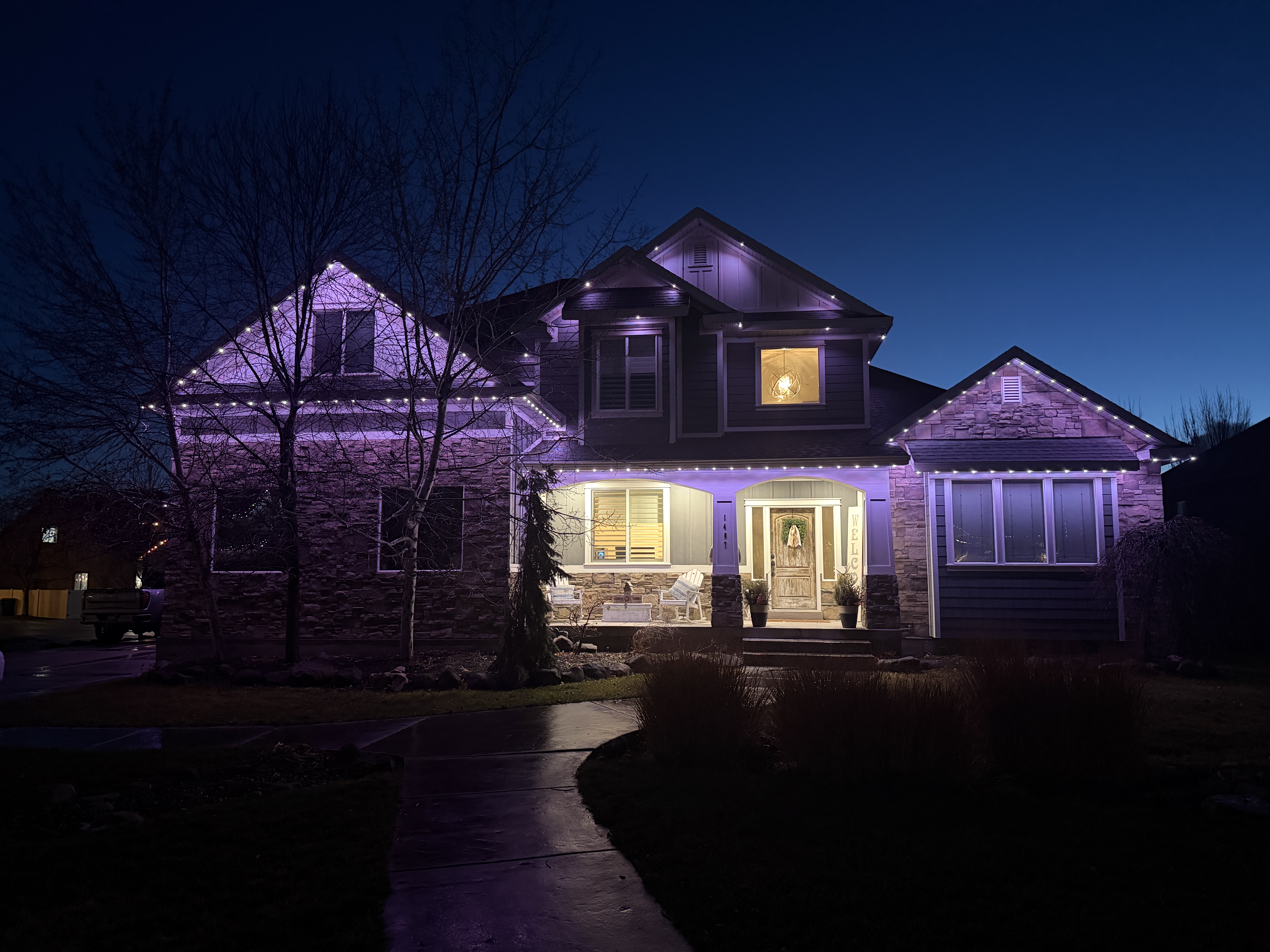Luxury home with outdoor lighting at night